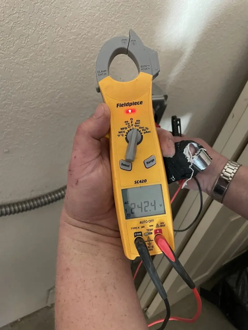 Voltage testing with clamp meter during Electrical Installation Services in Golden